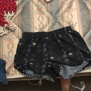 Black and purple Under Armor workout shorts